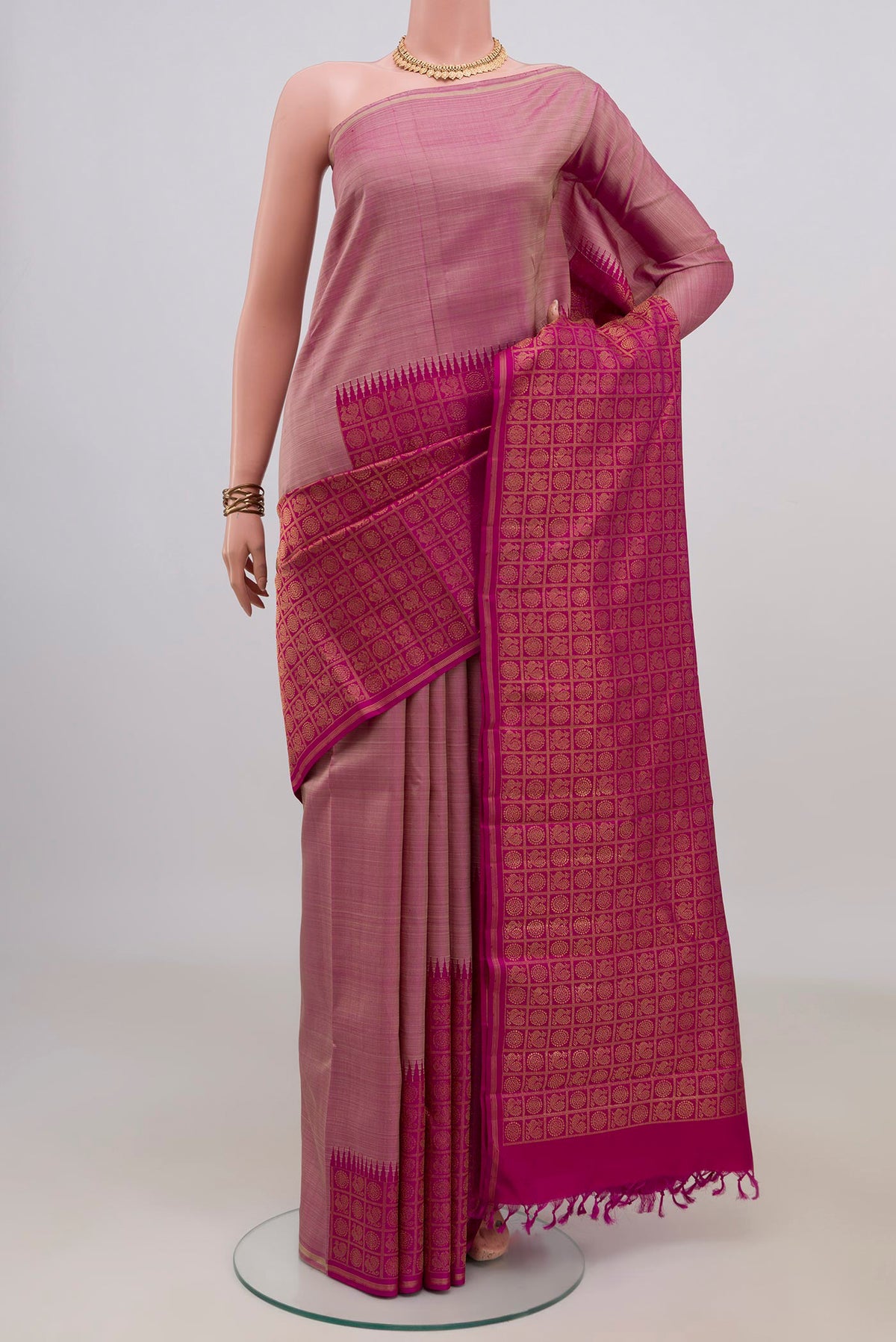 Pure Silk Pure Zari Multi Color Kanjivaram Saree with Fancy on the body and Rising Temple Border.  displayed on a mannequin