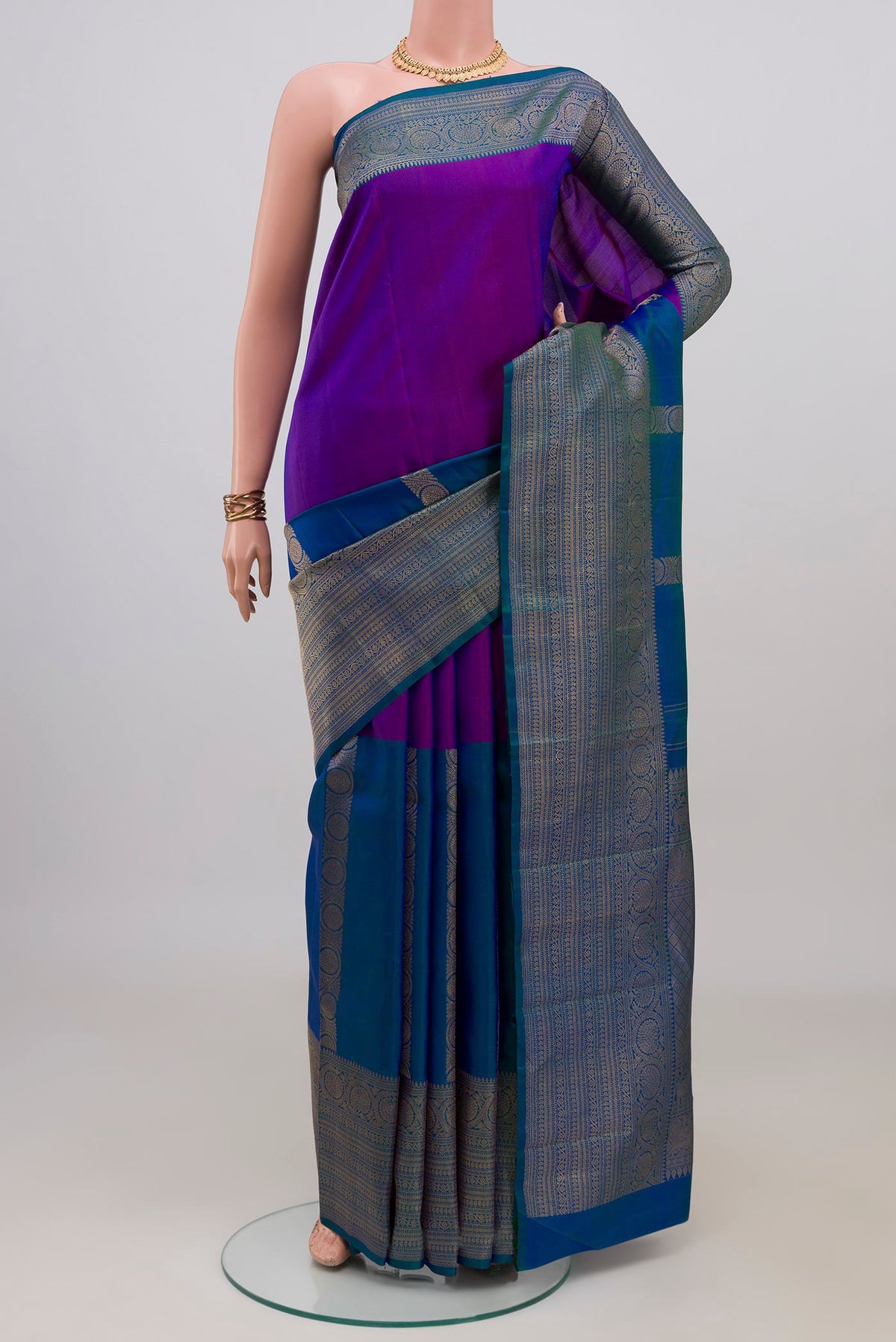 Pure Silk Pure Zari Multi Color Kanjivaram Saree with Half And Half on the body and Zari Border.  displayed on a mannequin