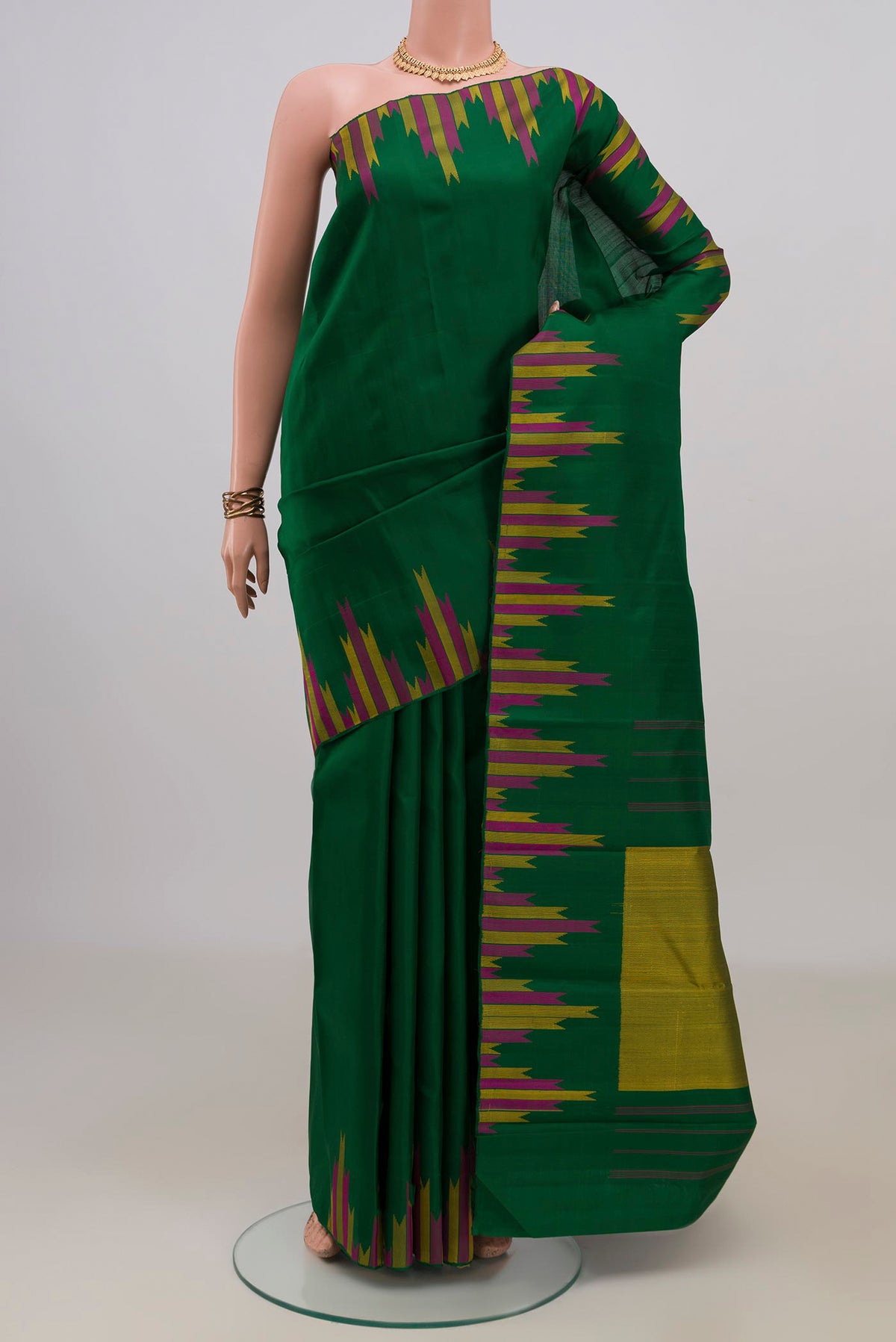 Pure Silk Green Kanjivaram Saree with Plain Body and Temple Border.  displayed on a mannequin