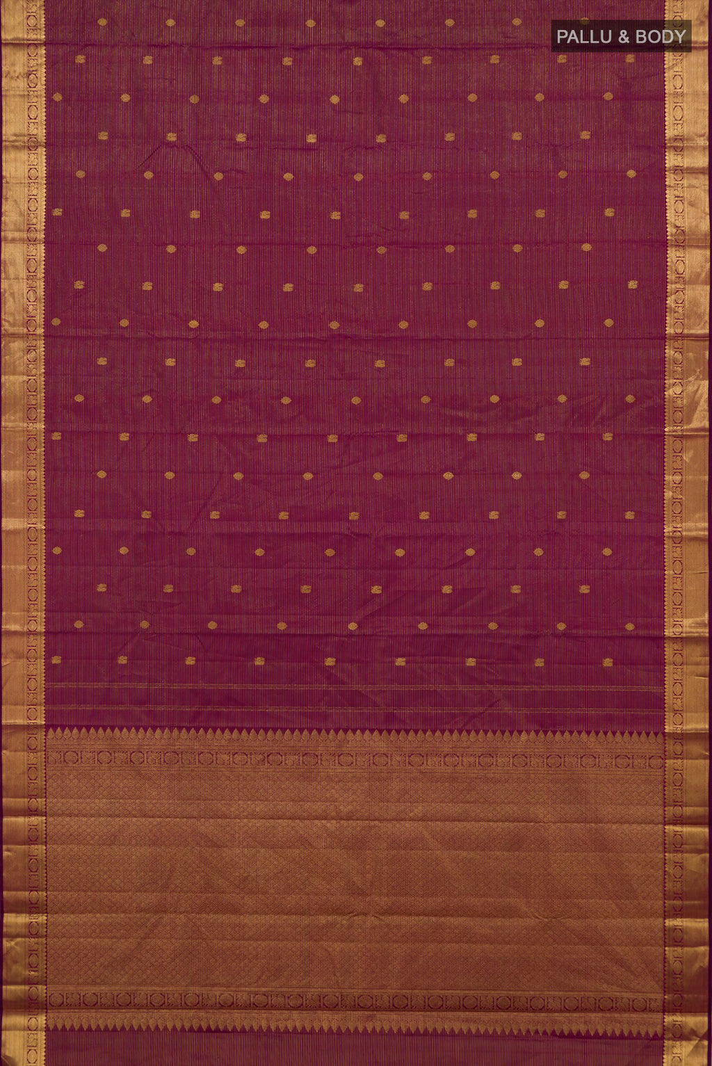 Flat view of Magenta Kanchipuram Silk Saree with Zari Butta on the body and Zari Border. 