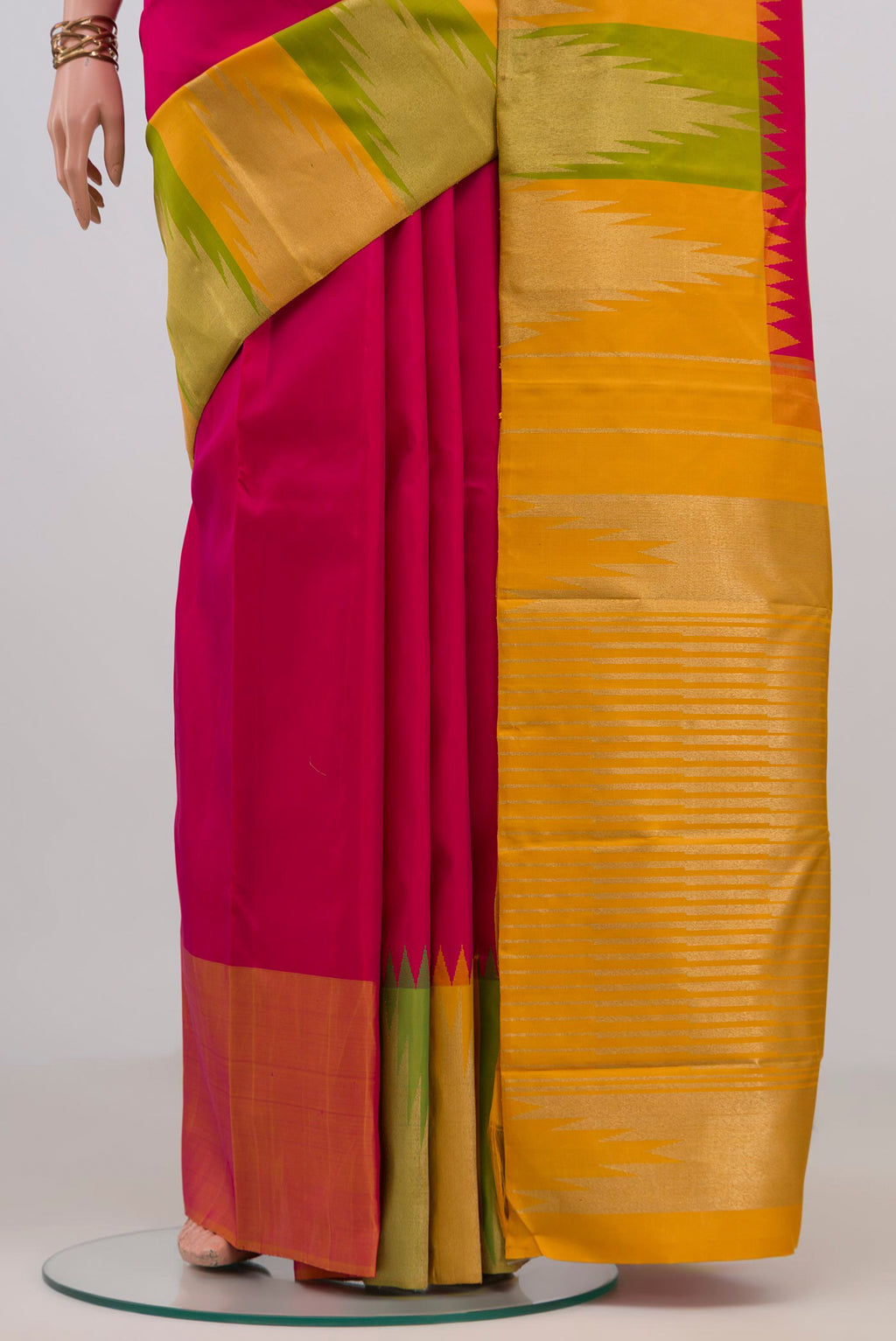 Pleats and pallu of Pure Silk Pure Zari Pink Kanjivaram Saree with Plain Body and Temple Border. 
