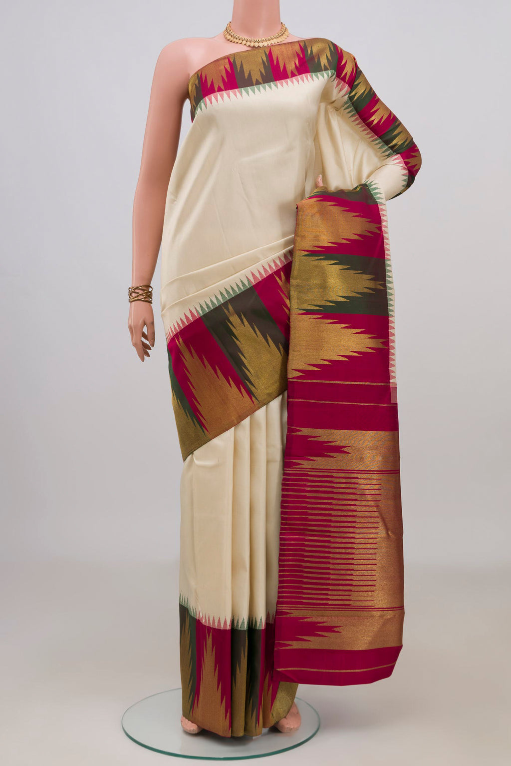 Pure Silk Pure Zari Cream Kanjivaram Saree with Plain Body and Temple Border.  displayed on a mannequin