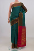 Pure Silk Green Kanchipuram Saree with Checked design on the body and Thin Zari Line.  displayed on a mannequin