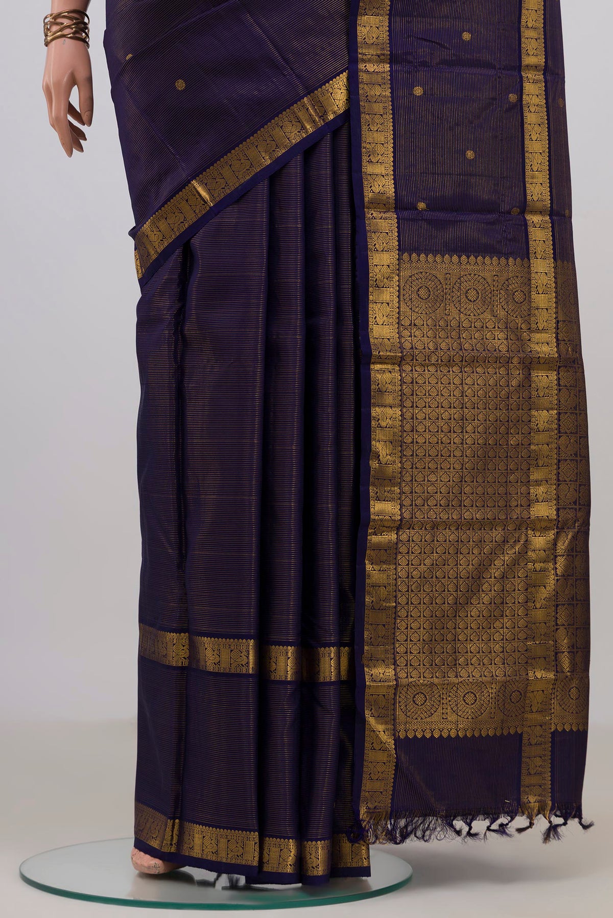 Pleats and pallu of Pure Silk Navy Blue Kanchipuram Saree with Stripes on the body and Fancy Border. 