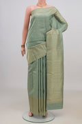 Pure Silk Sage Green Kanjivaram Saree with Zari Butta on the body and Fancy Border.  displayed on a mannequin