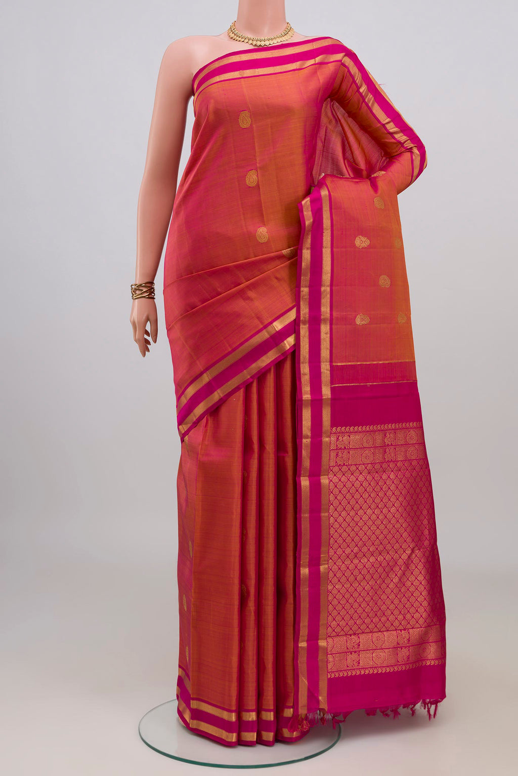Pink Dual Tone Kanchipuram Silk Saree with Zari Butta on the body and Zari Border.  displayed on a mannequin