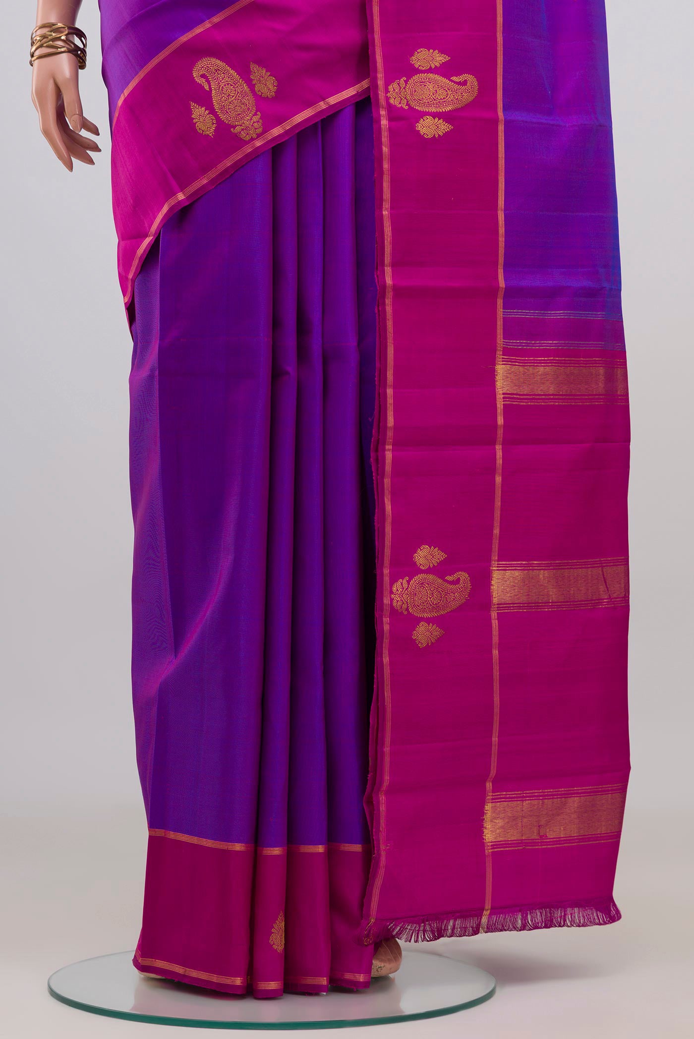 Pleats and pallu of Purple Kanchipuram Silk Saree with Plain Body and Plain Border. 