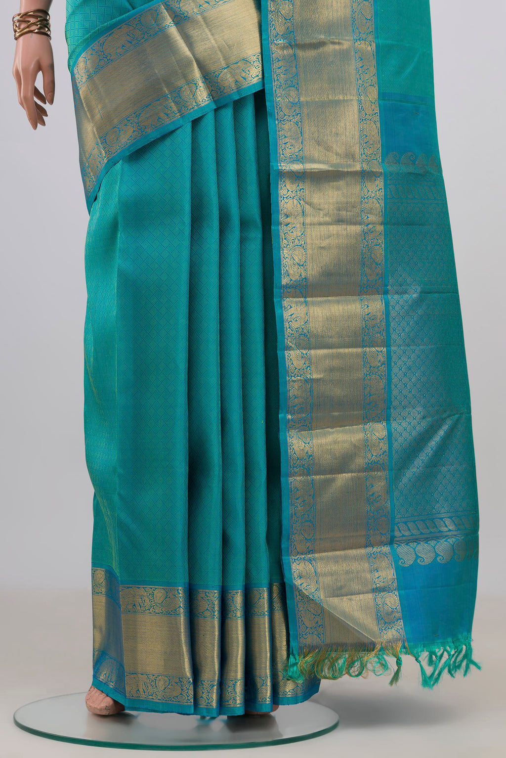 Pleats and pallu of Pure Silk Turquoise Kanjivaram Saree with Jacquard design on the body and Zari Border. 