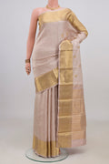 Pure Silk Beige Kanjivaram Saree with Jacquard With Zari Butta on the body and Zari Border.  displayed on a mannequin