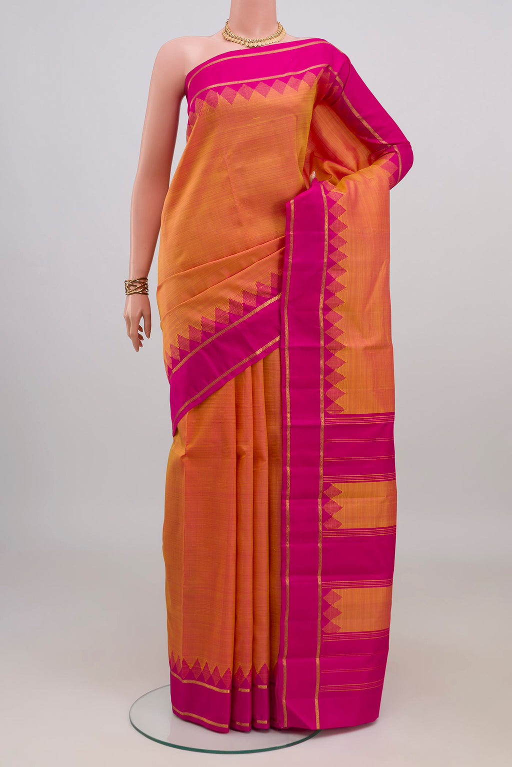 Pure Silk Pure Zari Pinkish Yellow Dual Tone Kanjivaram Saree with Plain Body and Thin Zari Line.  displayed on a mannequin
