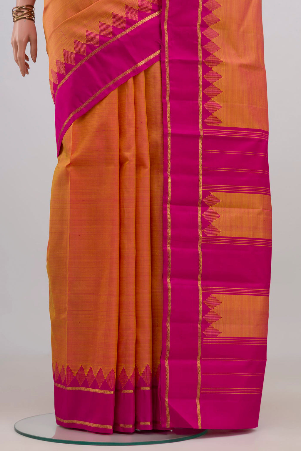 Pleats and pallu of Pure Silk Pure Zari Pinkish Yellow Dual Tone Kanjivaram Saree with Plain Body and Thin Zari Line. 