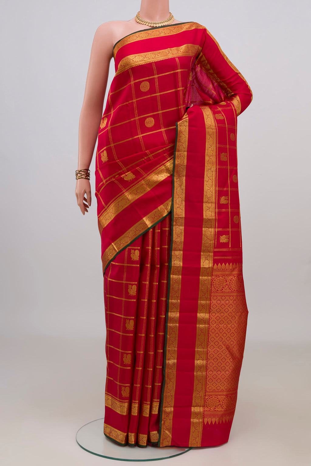 Pure Silk Red Kanjivaram Saree with Checked design on the body and Zari Border.  displayed on a mannequin