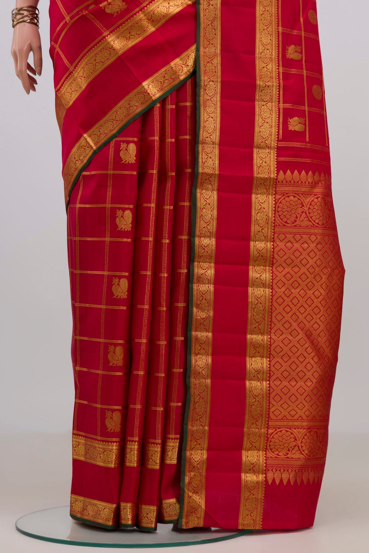Pleats and pallu of Pure Silk Red Kanjivaram Saree with Checked design on the body and Zari Border. 