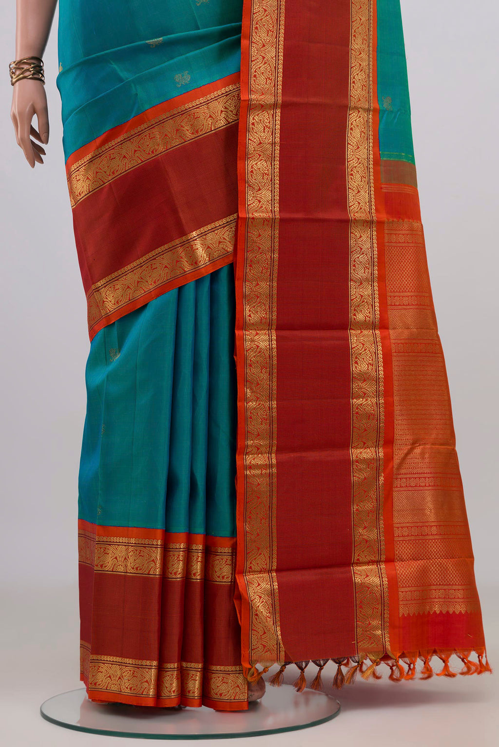 Pleats and pallu of Pure Silk Pure Zari Blue Kanjivaram Saree with Zari Butta on the body and Zari Border. 