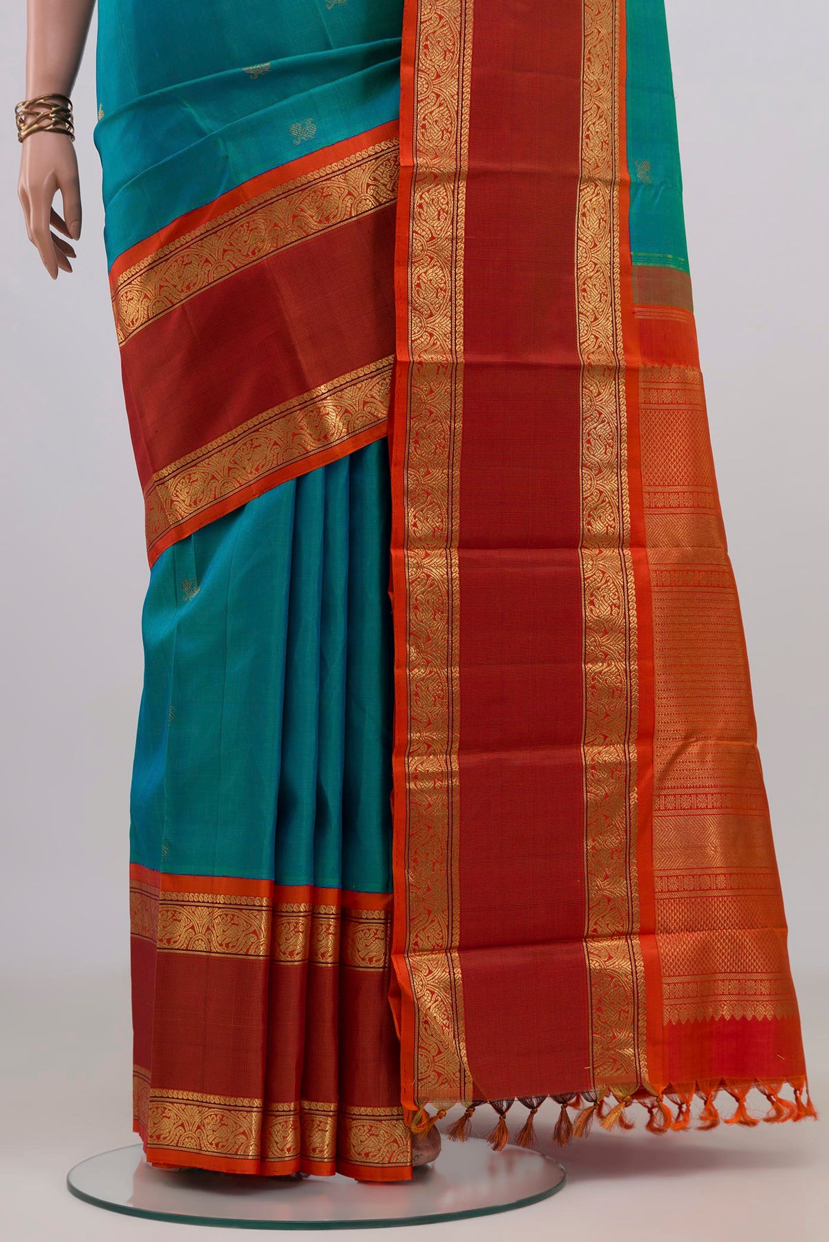 Pleats and pallu of Pure Silk Pure Zari Blue Kanjivaram Saree with Zari Butta on the body and Zari Border. 