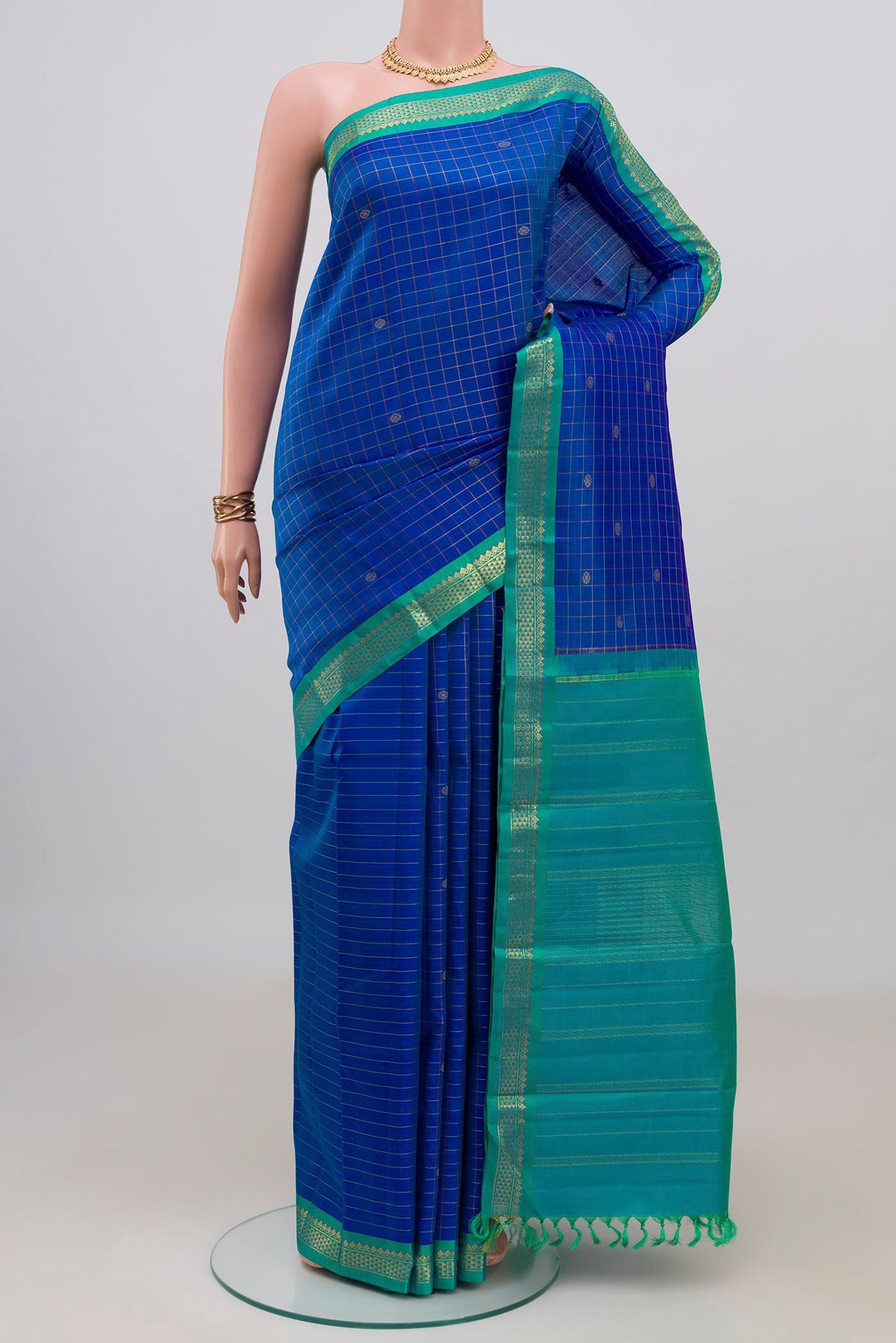 Pure Silk Pure Zari Royal Blue Kanjivaram Saree with Checked design on the body and Zari Border.  displayed on a mannequin