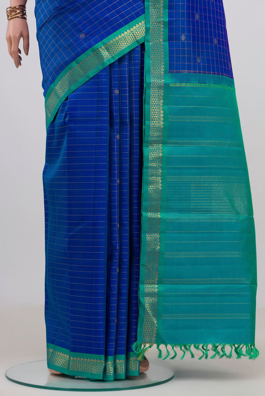Pleats and pallu of Pure Silk Pure Zari Royal Blue Kanjivaram Saree with Checked design on the body and Zari Border. 