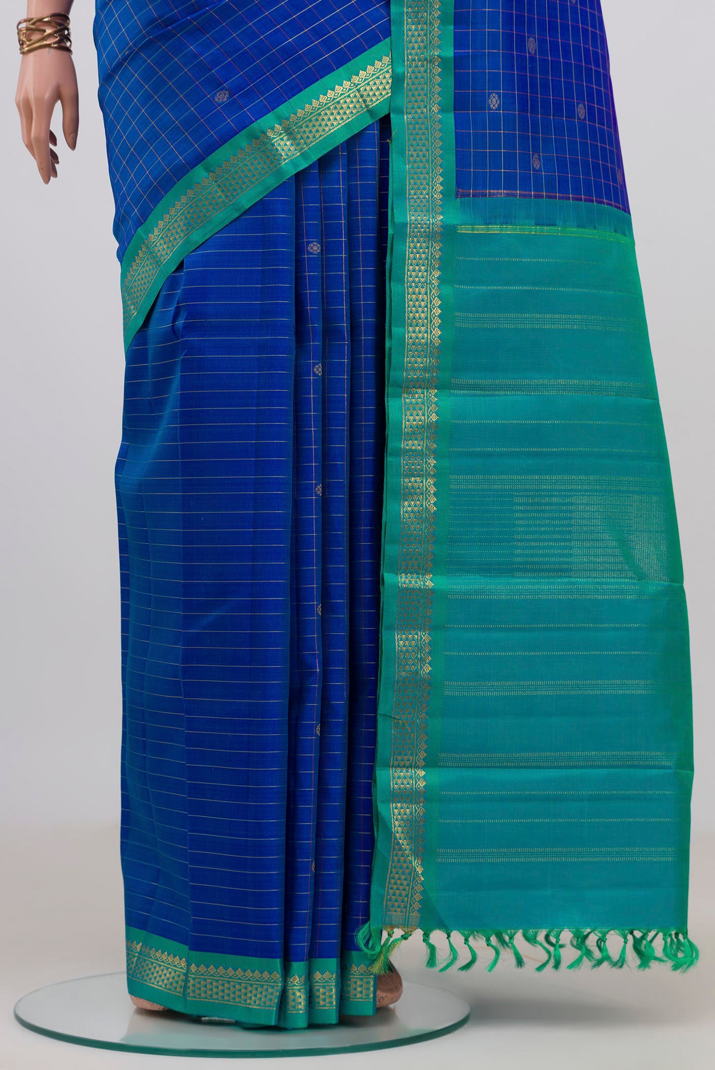 Pleats and pallu of Pure Silk Pure Zari Royal Blue Kanjivaram Saree with Checked design on the body and Zari Border. 
