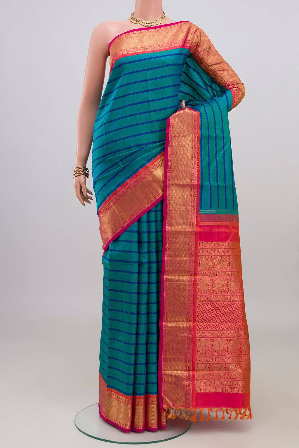 Pure Silk Pure Zari Blue Kanjivaram Saree with Veldhari on the body and Zari Border.  displayed on a mannequin