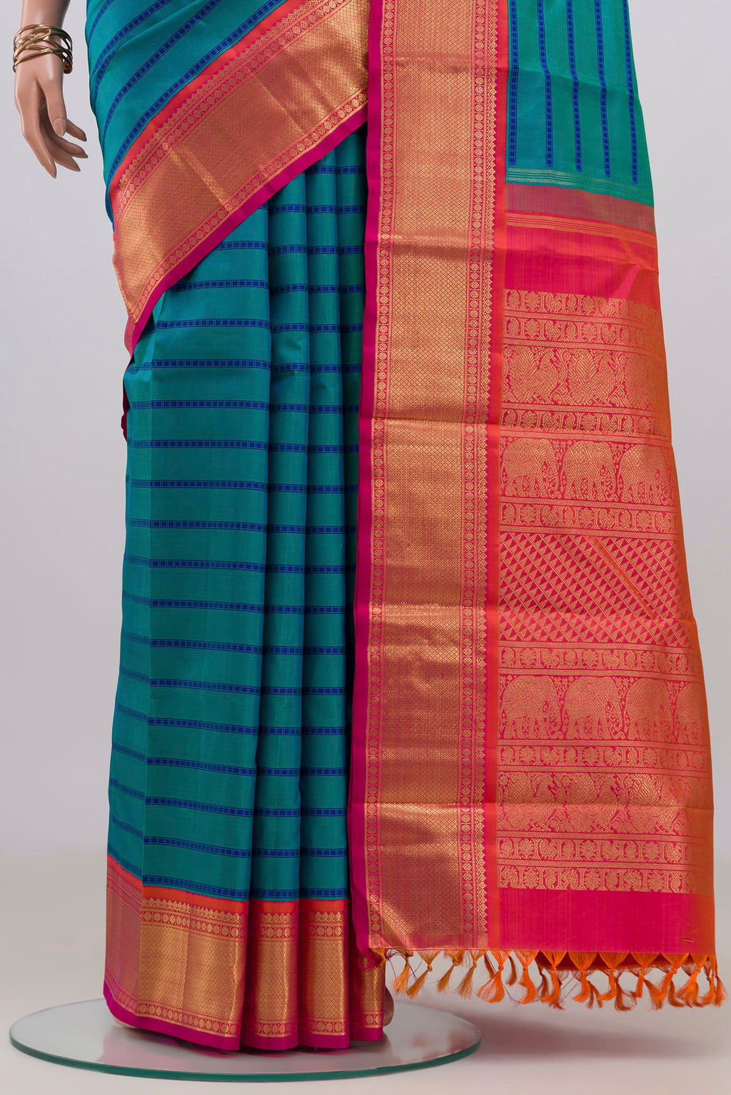 Pleats and pallu of Pure Silk Pure Zari Blue Kanjivaram Saree with Veldhari on the body and Zari Border. 