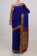 Pure Silk Pure Zari Blue Kanjivaram Saree with Checked design on the body and Zari Border.  displayed on a mannequin