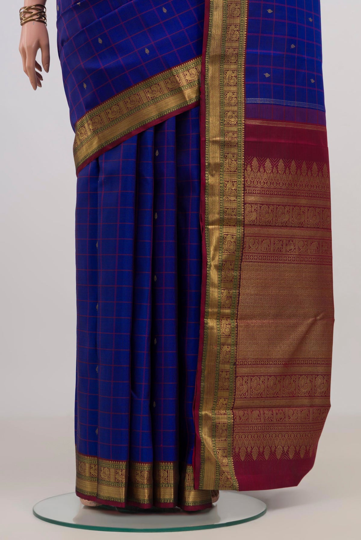 Pleats and pallu of Pure Silk Pure Zari Blue Kanjivaram Saree with Checked design on the body and Zari Border. 