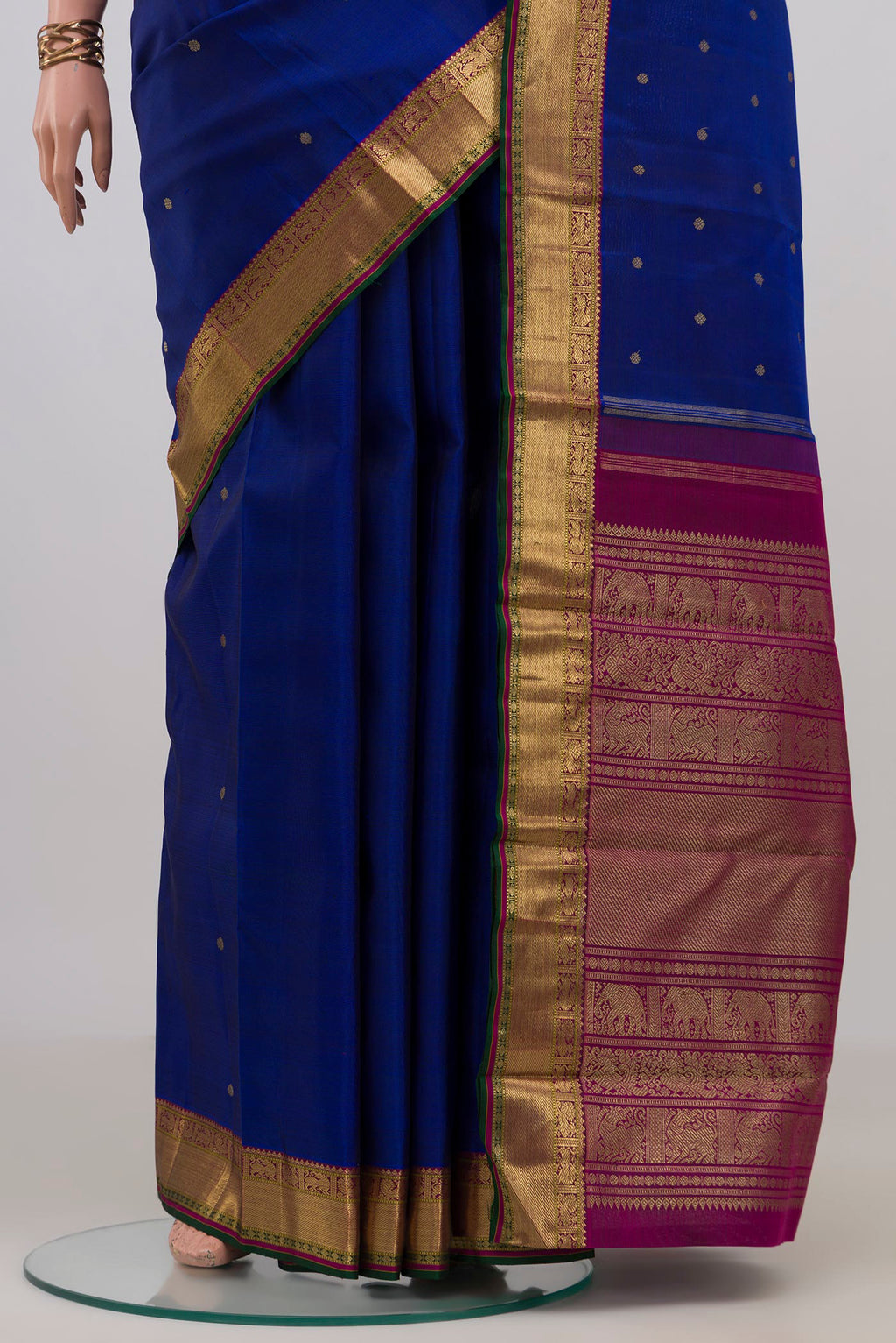Pleats and pallu of Pure Silk Pure Zari Blue Kanjivaram Saree with Zari Butta on the body and Zari Border. 