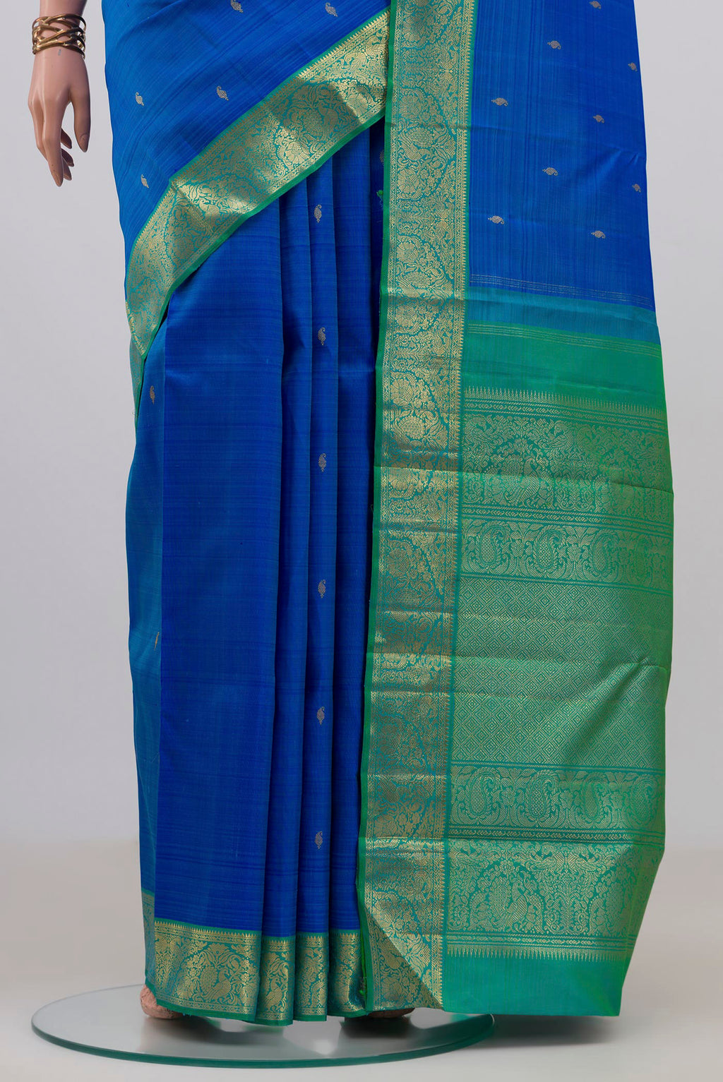 Pleats and pallu of Pure Silk Pure Zari Royal Blue Kanjivaram Saree with Zari Butta on the body and Zari Border. 