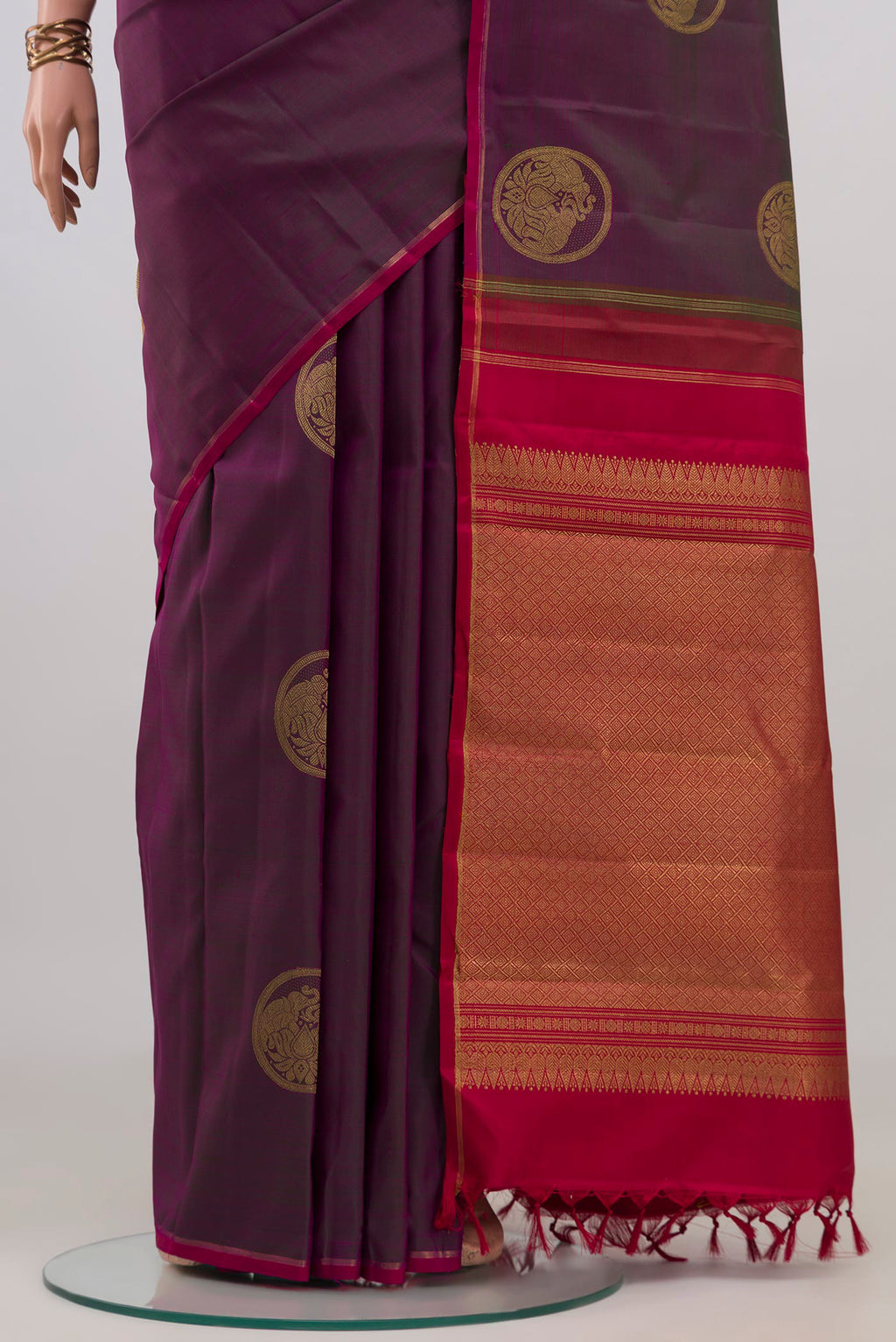 Pleats and pallu of Pure Silk Pure Zari Purple Kanchipuram Saree with Zari Butta on the body and Thin Zari Line. 