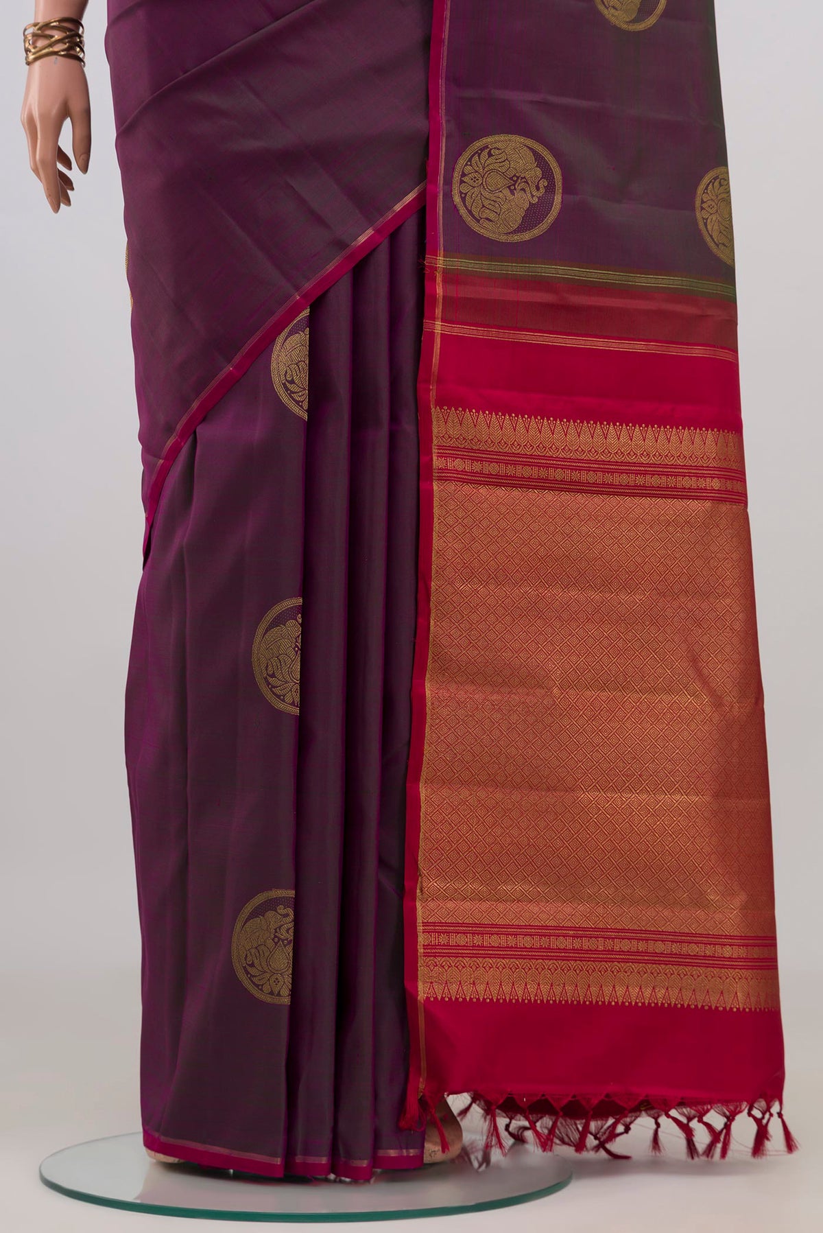 Pleats and pallu of Pure Silk Pure Zari Purple Kanchipuram Saree with Zari Butta on the body and Thin Zari Line. 