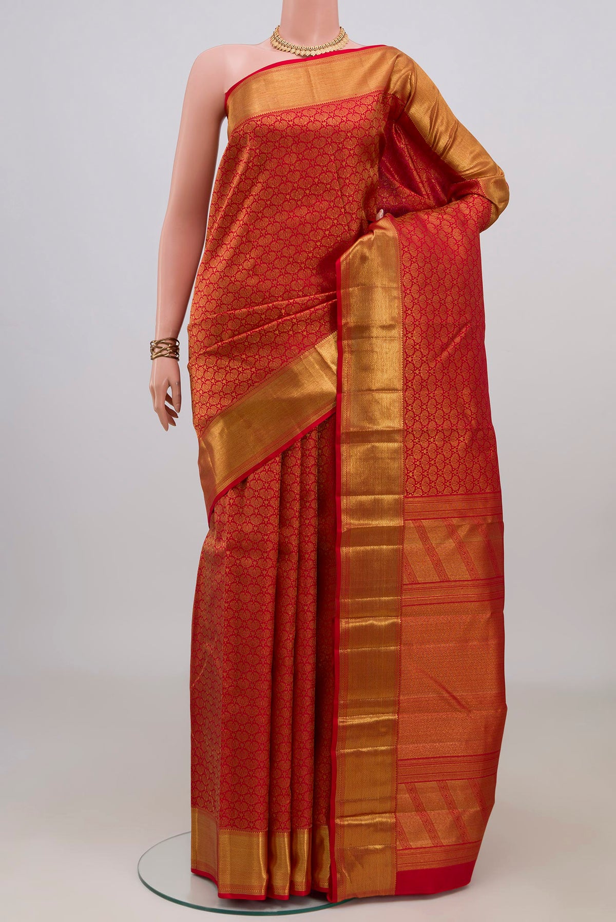 Pure Silk Red Kanchipuram Saree with Zari Brocade on the body and Zari Border.  displayed on a mannequin