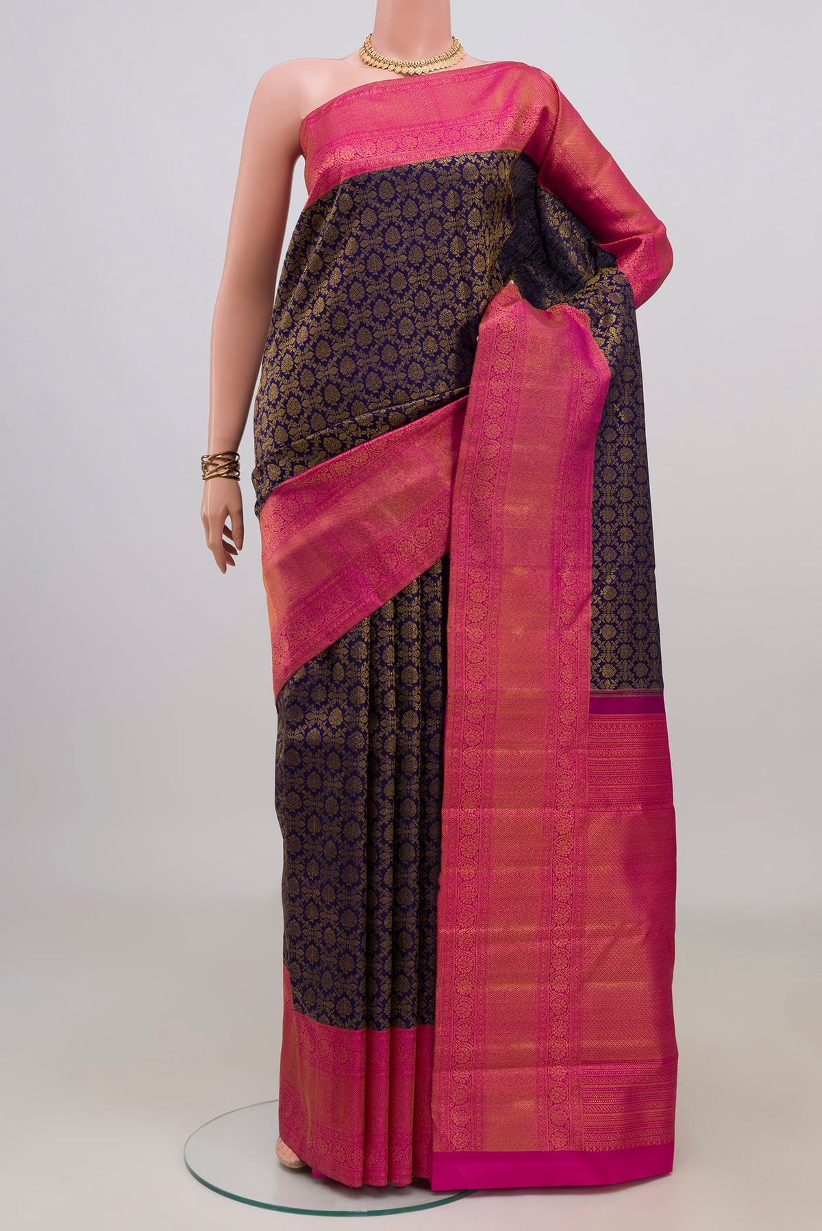 Pure Silk Navy Blue Kanjivaram Saree with Zari Brocade on the body and Zari Border.  displayed on a mannequin