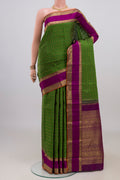 Pure Silk Pure Zari Green Kanjivaram Saree with Checked design on the body and Zari Border.  displayed on a mannequin