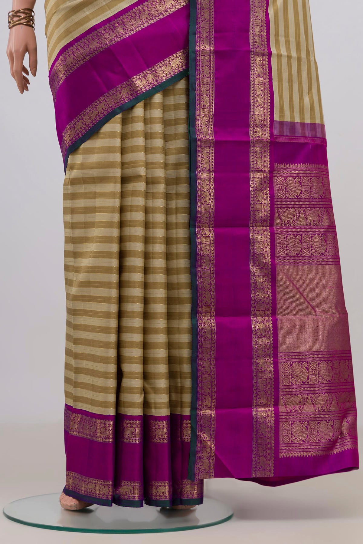 Pleats and pallu of Pure Silk Pure Zari Beige Kanjivaram Saree with Stripes on the body and Zari Border. 