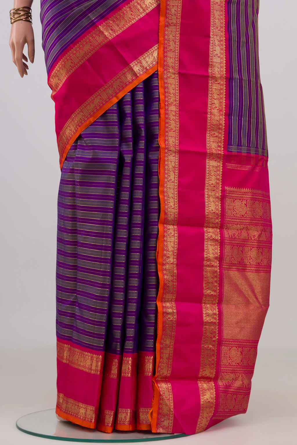 Pleats and pallu of Pure Silk Pure Zari Purple Kanjivaram Saree with Stripes on the body and Zari Border. 