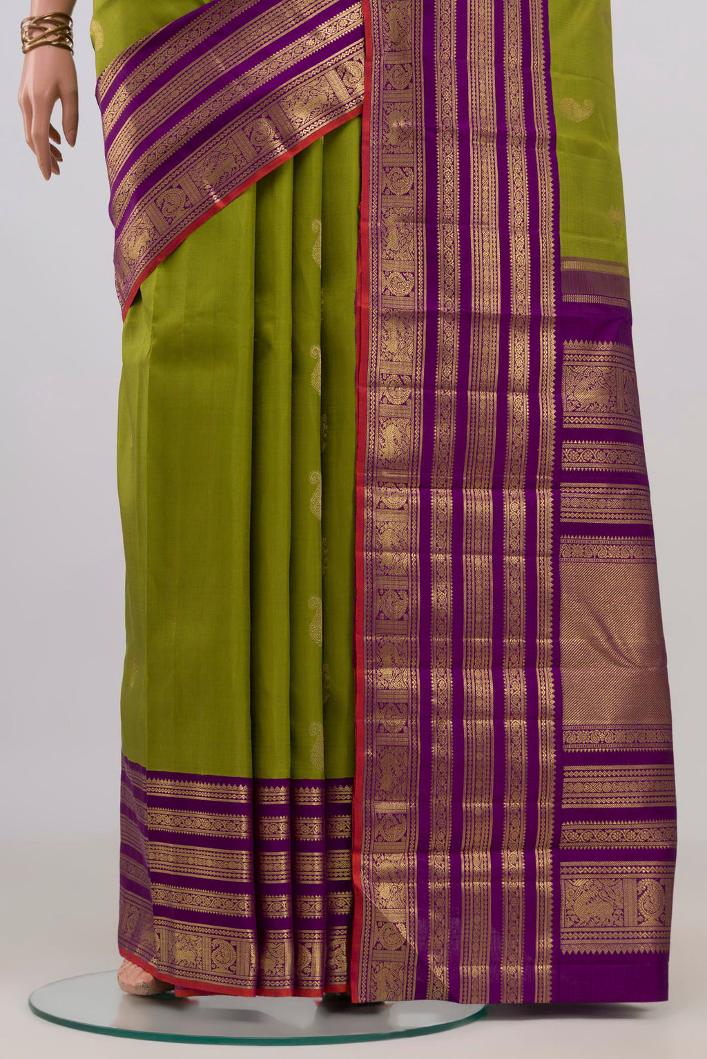 Pleats and pallu of Pure Silk Pure Zari Green Kanjivaram Saree with Zari Butta on the body and Zari Border. 