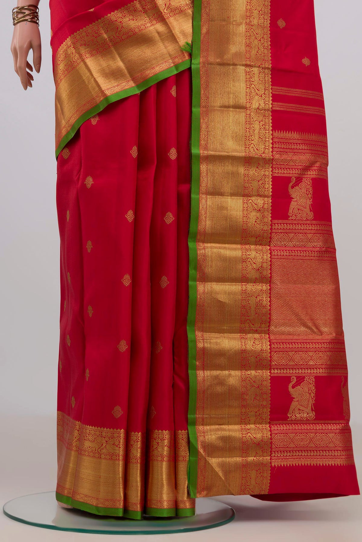 Pleats and pallu of Pure Silk Pure Zari Red Kanjivaram Saree with Zari Butta on the body and Zari Border. 