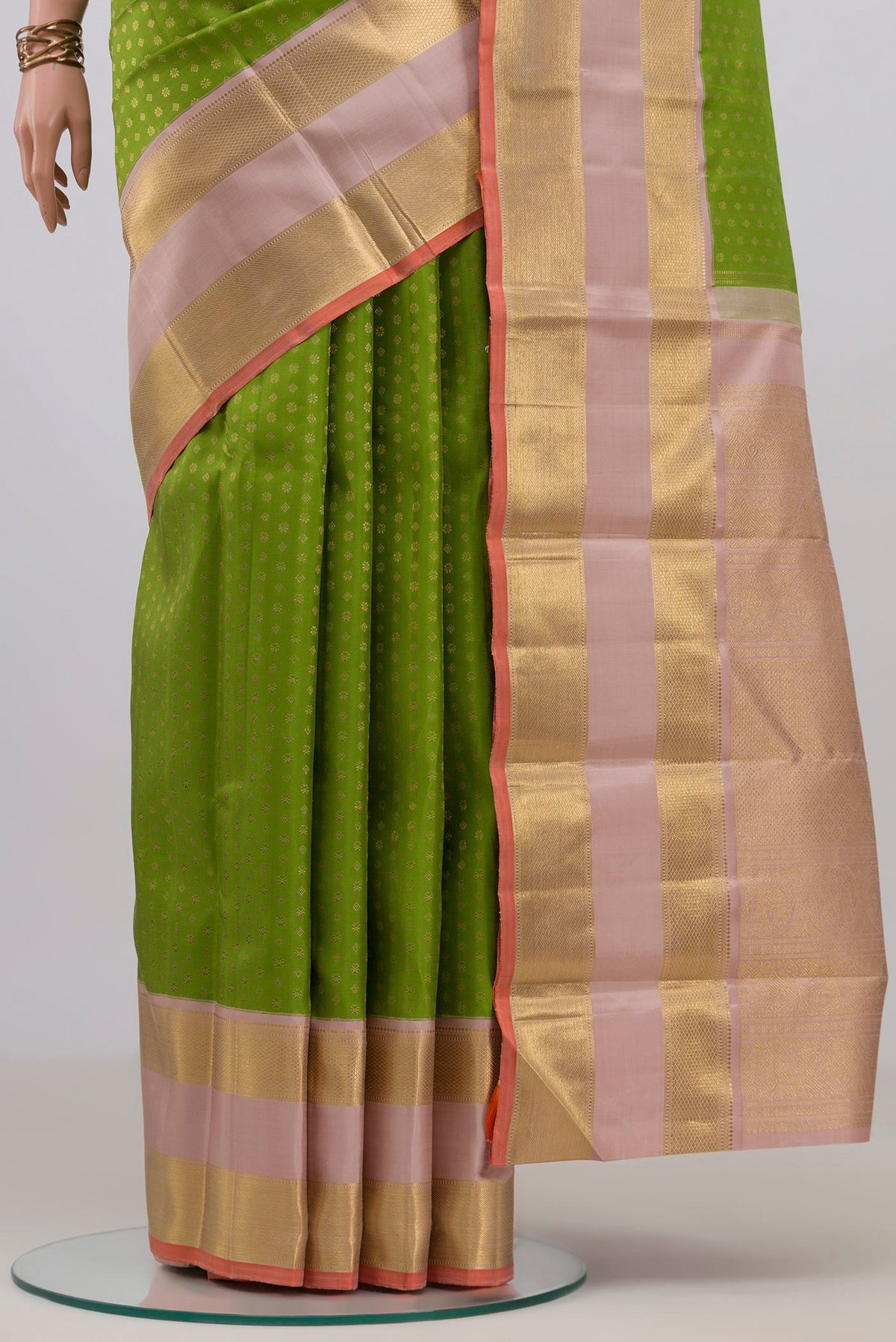 Pleats and pallu of Pure Silk Pure Zari Green Kanjivaram Saree with Zari Butta on the body and Zari Border. 