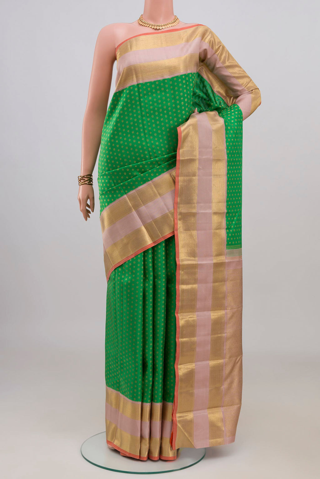 Pure Silk Pure Zari Green Kanjivaram Saree with Zari Butta on the body and Zari Border.  displayed on a mannequin