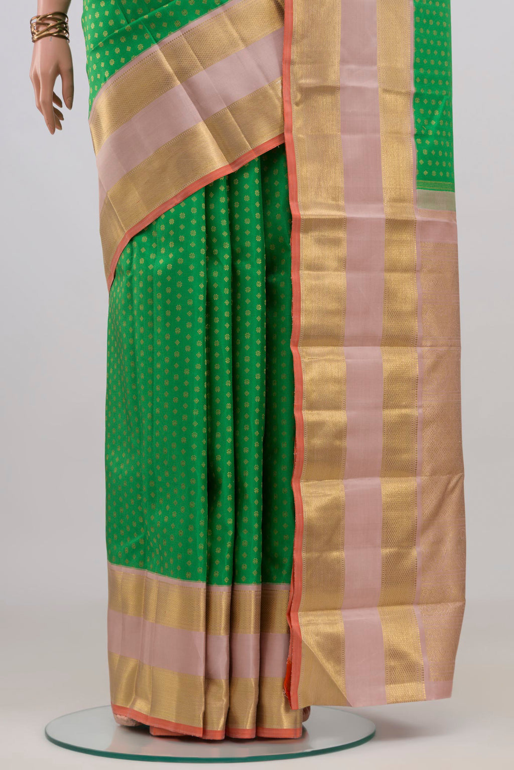 Pleats and pallu of Pure Silk Pure Zari Green Kanjivaram Saree with Zari Butta on the body and Zari Border. 