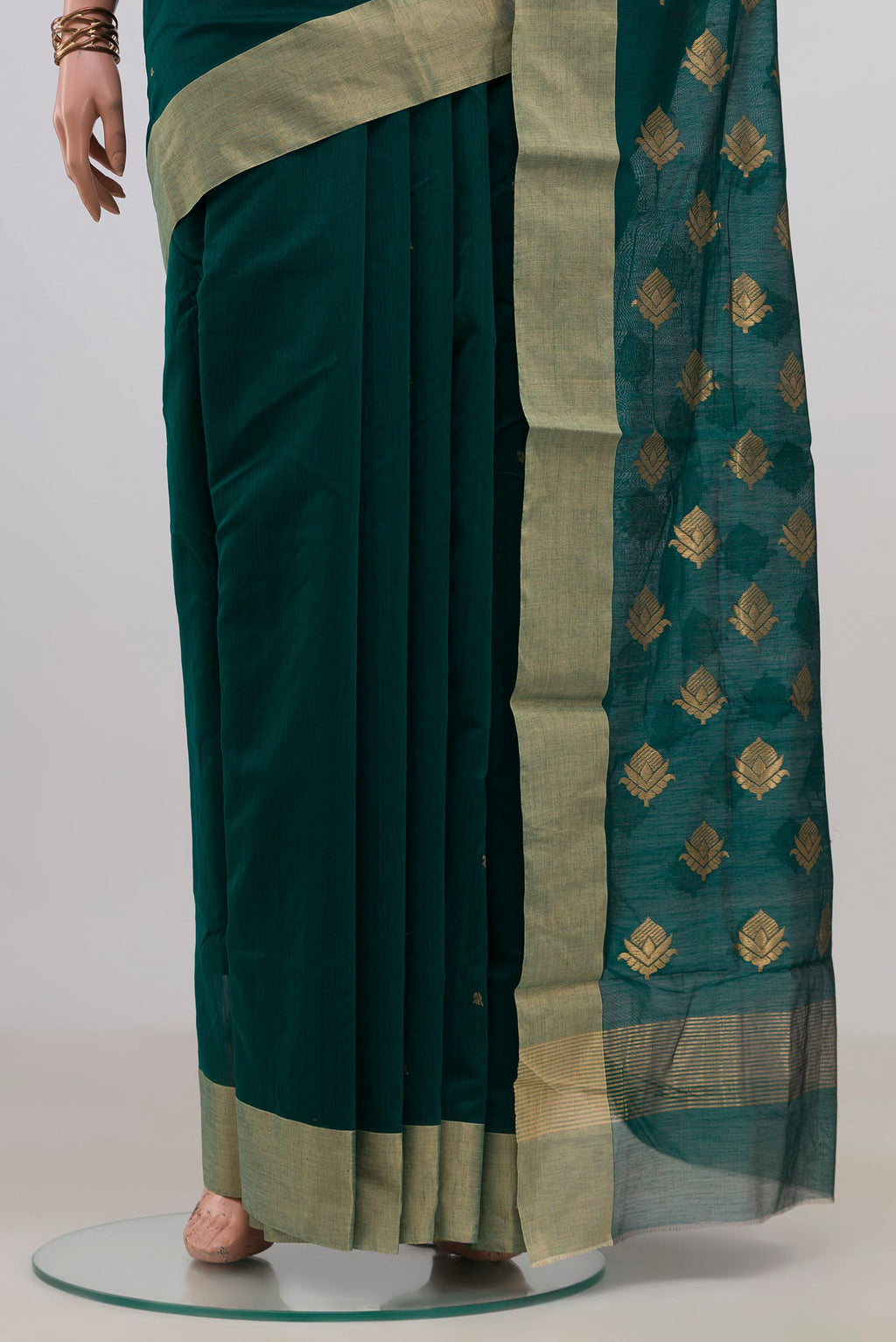 Pleats and pallu of Bottle Green Chanderi Cotton Saree with Zari Butta on the body and Zari Border. 