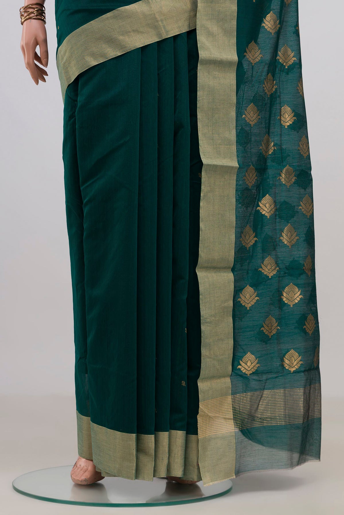 Pleats and pallu of Bottle Green Chanderi Cotton Saree with Zari Butta on the body and Zari Border. 