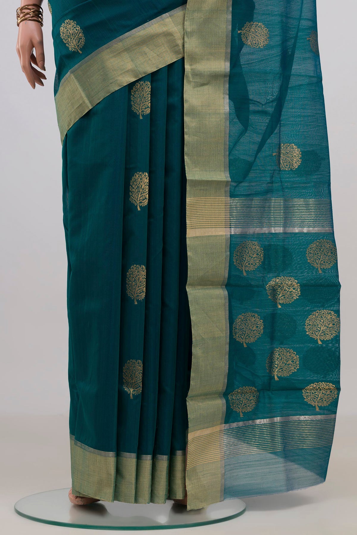 Pleats and pallu of Teal Chanderi Cotton Saree with Zari Butta on the body and Zari Border. 