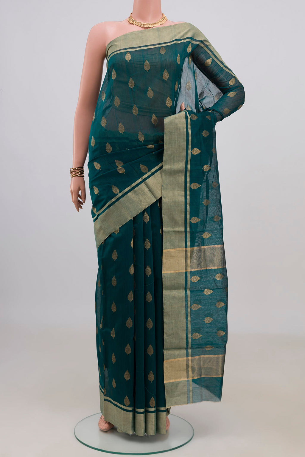 Green Chanderi Cotton Saree with Zari Butta on the body and Zari Border.  displayed on a mannequin