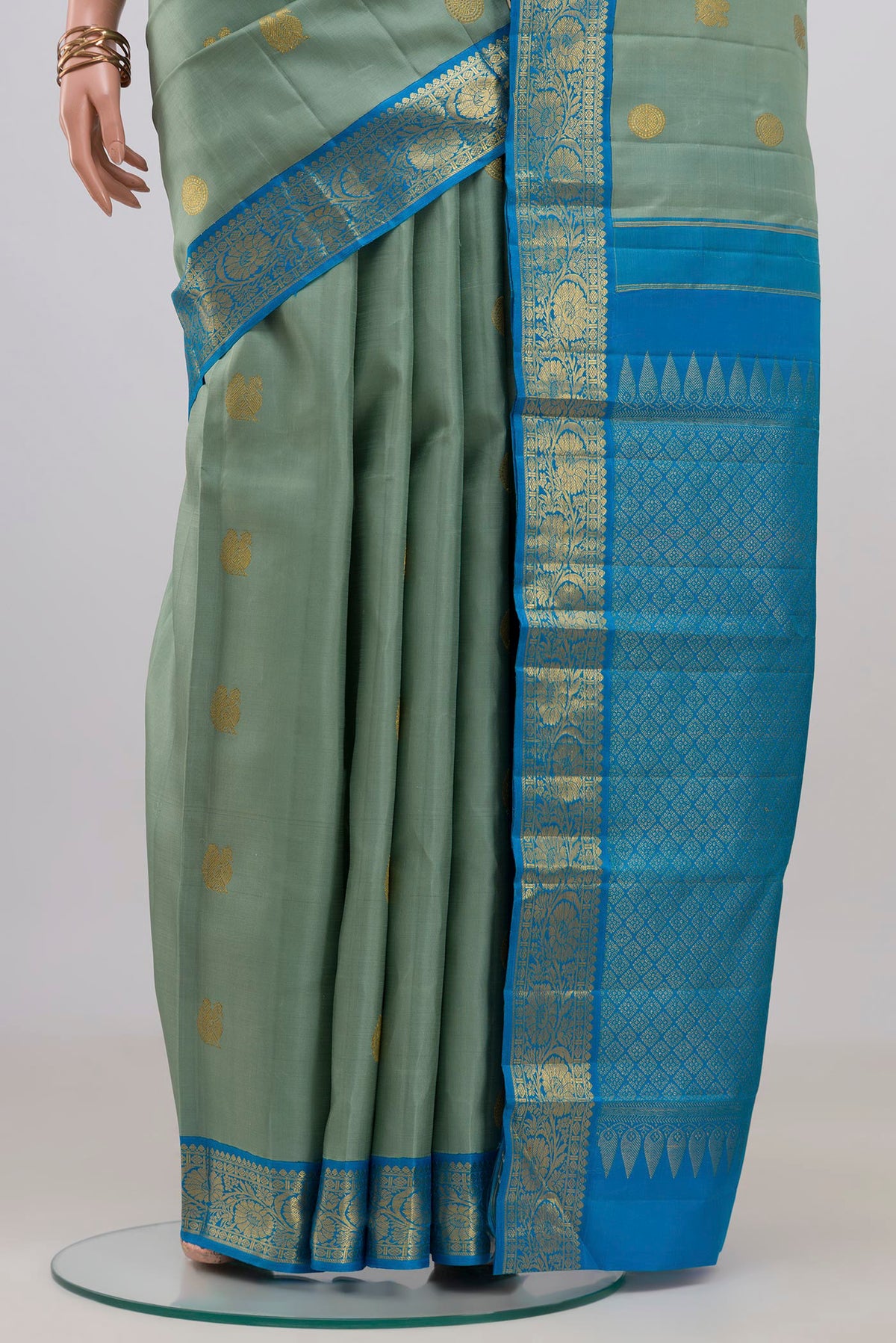 Pleats and pallu of Blue Kanjivaram Silk Saree with Zari Butta on the body and Zari Border. 