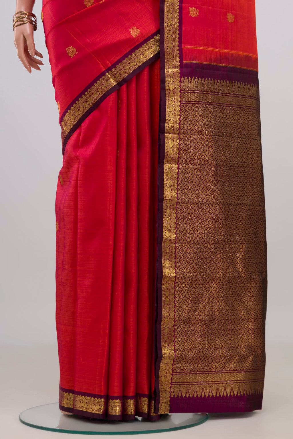 Pleats and pallu of Pink Kanchipuram Silk Saree with Zari Butta on the body and Zari Border. 