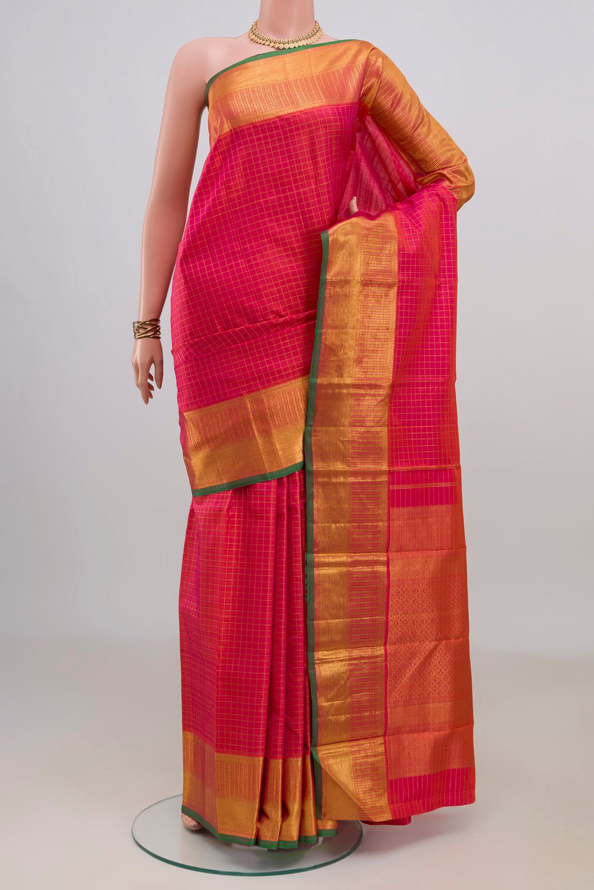 Pure Silk Pink Dual Tone Kanjivaram Saree with Checked design on the body and Zari Border.  displayed on a mannequin