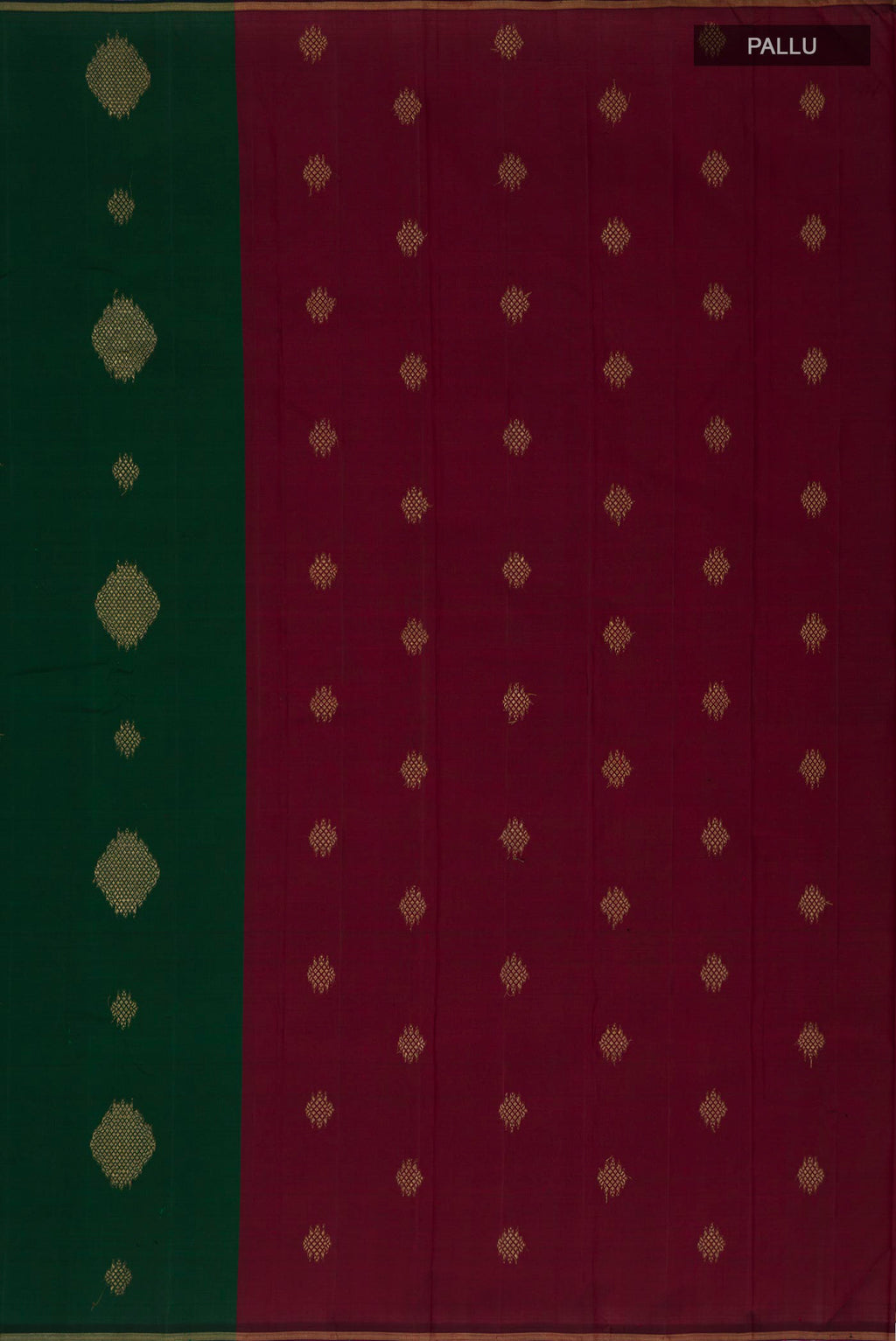 Close up image of the pallu of Bottle Green Kanchipuram Silk Saree with Zari Butta on the body and Thin Zari Line. 