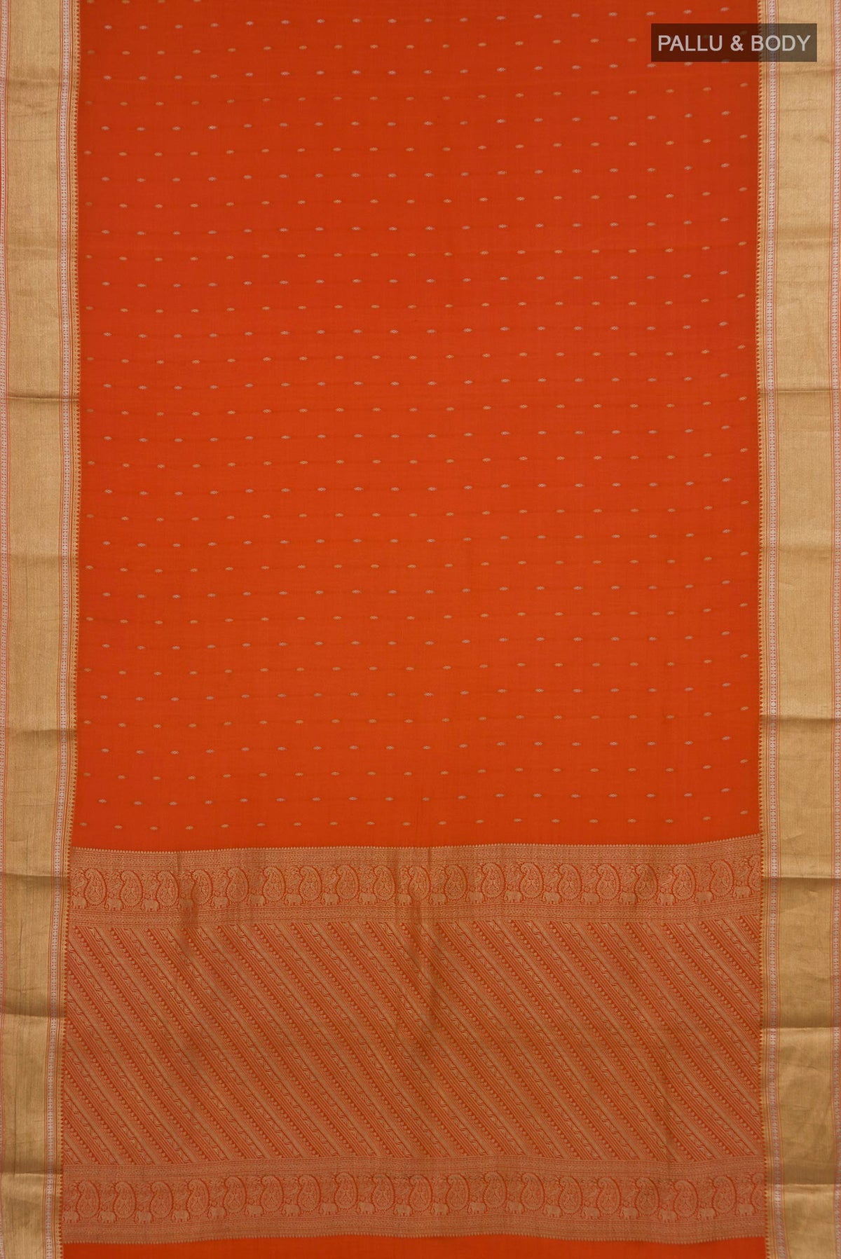 Flat view of Orange Mysore Crepe Saree with Zari Butta on the body and Zari Border. 