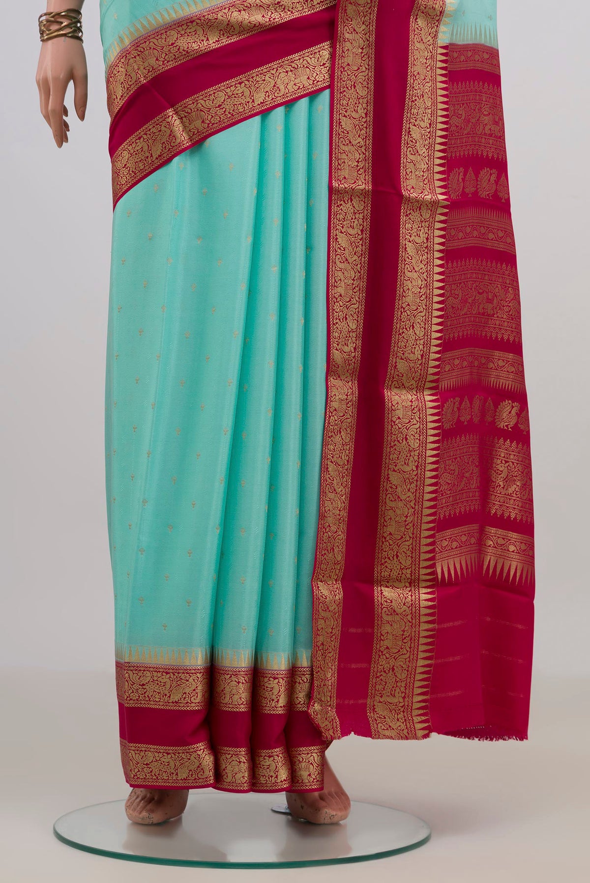 Pleats and pallu of Turquoise Mysore Chiffon Saree with Zari Butta on the body and Zari Border. 